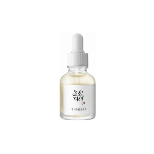 Skincare serum bottle with dropper on a white background
