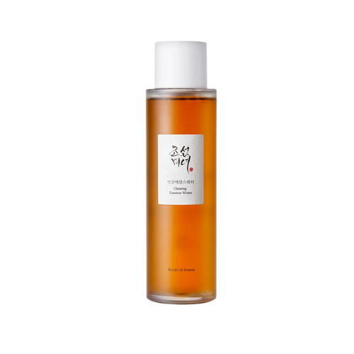 Skincare bottle with a white cap and orange liquid on a white background
