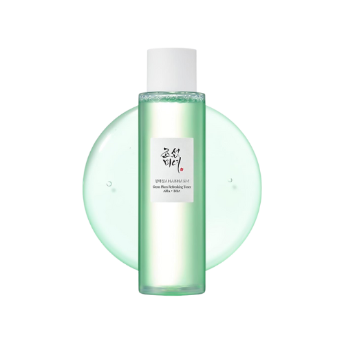 Skincare bottle with a green liquid on a white background