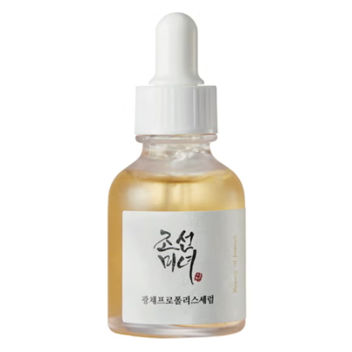 Skincare serum bottle with dropper on a white background