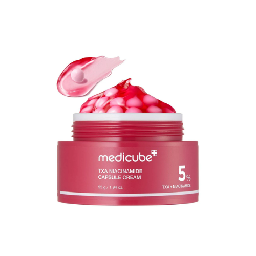 Red jar of Medicube Txa Niacinamide Capsule Cream with pink cream on a white background